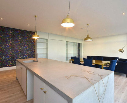 Penthouse Polished Concrete Island with Brass Detail